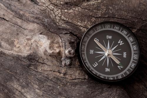 Navigation compass sitting on wood